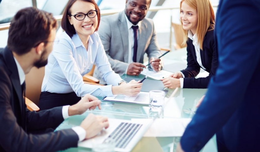 Group gathered around conference table 