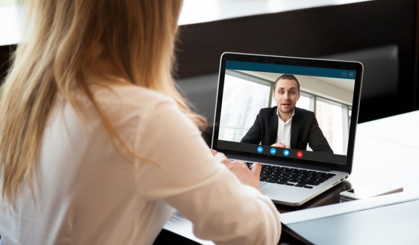 Woman in interview on computer