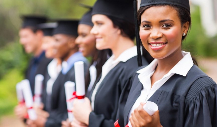 Graduates with diplomas