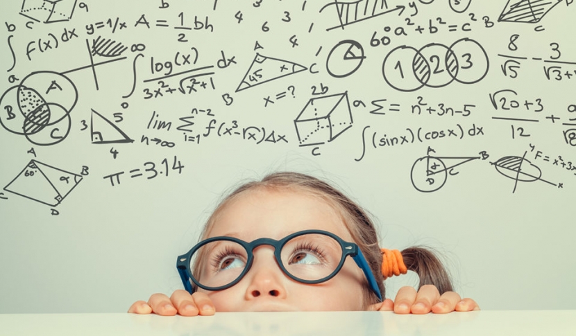 child looking up at math equations