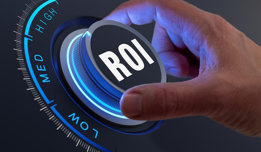 A hand turning a dial labeled ROI