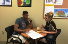 Two people studying at a table 