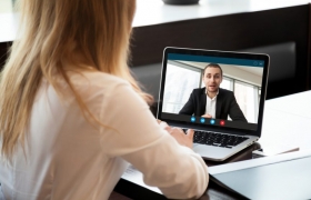 Woman in interview on computer