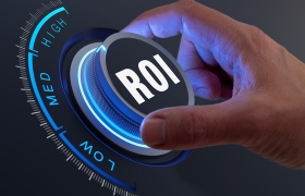 A hand turning a dial labeled ROI